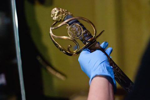 Installing Governor Lachlan Macquarie's sword in the Landmarks gallery.