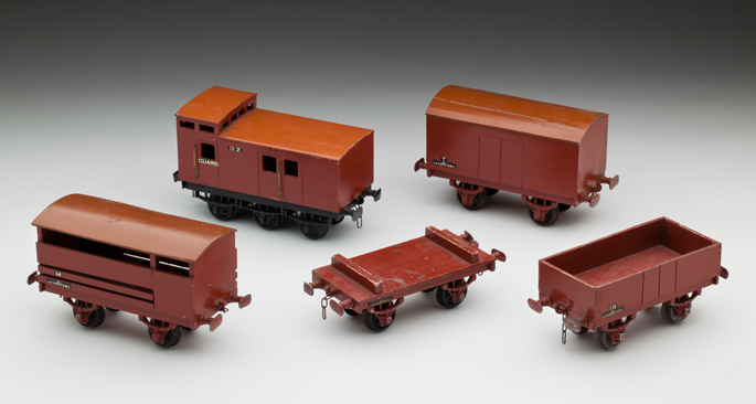 (l-r) Victorian Railways ‘M’ cattle van, ‘Z’ brake van, flat wagon, ‘T’ goods van and ‘IB’ open wagon, made from wood with lead composition and diecast wheels by John May and Alan Budge