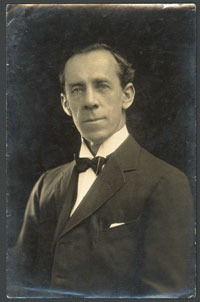 Sepia-toned photograph of white male wearing early twentieth century clothing.
