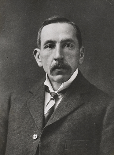 Studio portrait photo of an expressionless Billy Hughes.