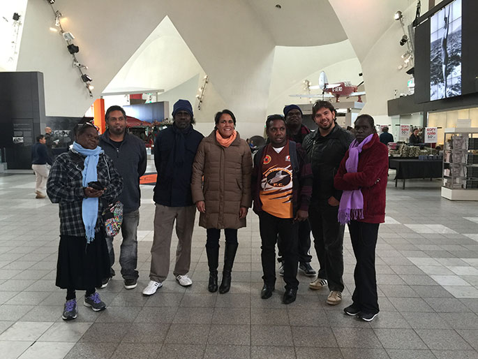 A group shot of visitors in the Main Hal at the National Museum of Australia.