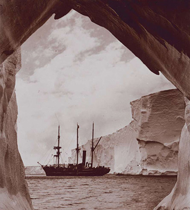 ship spotted through hole in glacial ice