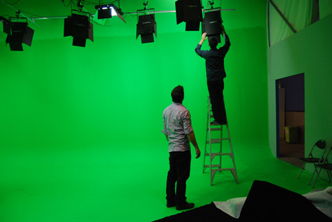 The crew set the levels and direction of the studio lights.