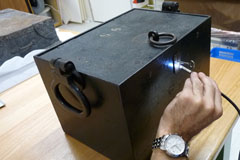 The locksmith inserts a blank key in order to gain an impression of the cut of the lock.