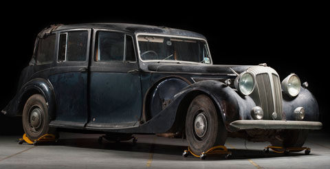 An historic motor vehicle in a museum storage facility.