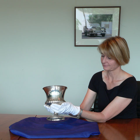 National Museum curator Kirsten Wehner holding the Junius Cup.