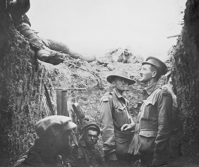 Black and white photo showing Australian soldiers in a trench