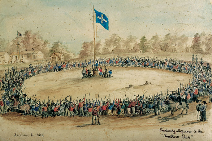 Hundreds of men encircle flag pole with Eureka flag at the top.