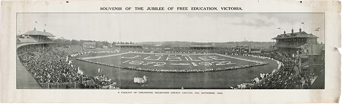 Panoramic black and white photograph of a large oval, possibly the MCG, with crowded stands. The words ‘Jubilee 1872 – 1922’ appear on the oval itself.