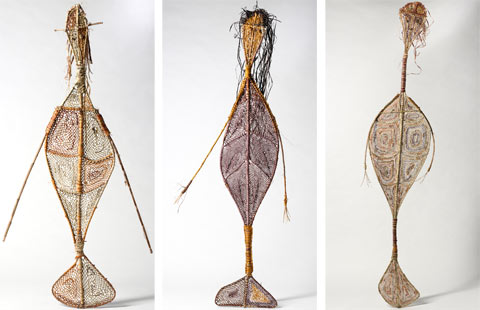 Three woven pandanus, mermaid-like Yawkyawk sculptures, by Kunwinjku artists (left) Marina Murdilnga and (centre and right) Lulu Laradjbi.