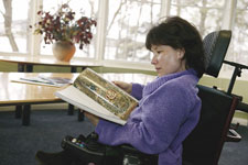 Volunteer Emma Burke in the reading room of the Library.