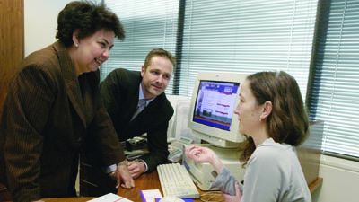 Director Dawn Casey, contractor Nic Welbourne and Fiona Honor discuss the the Museum's online annual report