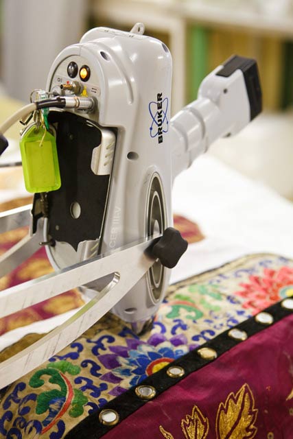 The XRF analysing the materials used in the construction of the decorative border of the Chinese costume on loan from Bendigo's Golden Dragon Museum.