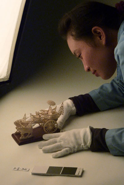 Mrs. Phonesamai Vilayvah, Collections, positioning ivory carving for photography.