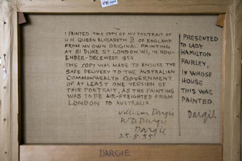 Rear view of a framed canvas with text painted in black.