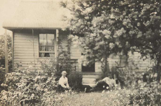 Ross and his mother Rose pictured outside their small weatherboard house