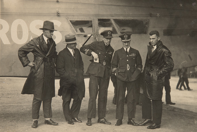 A black and white photo 'Southern Cross' aircraft with the crew standing in front of it.