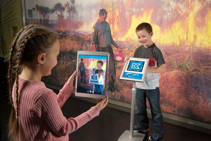 A boy and girl using the Kspace AR app
