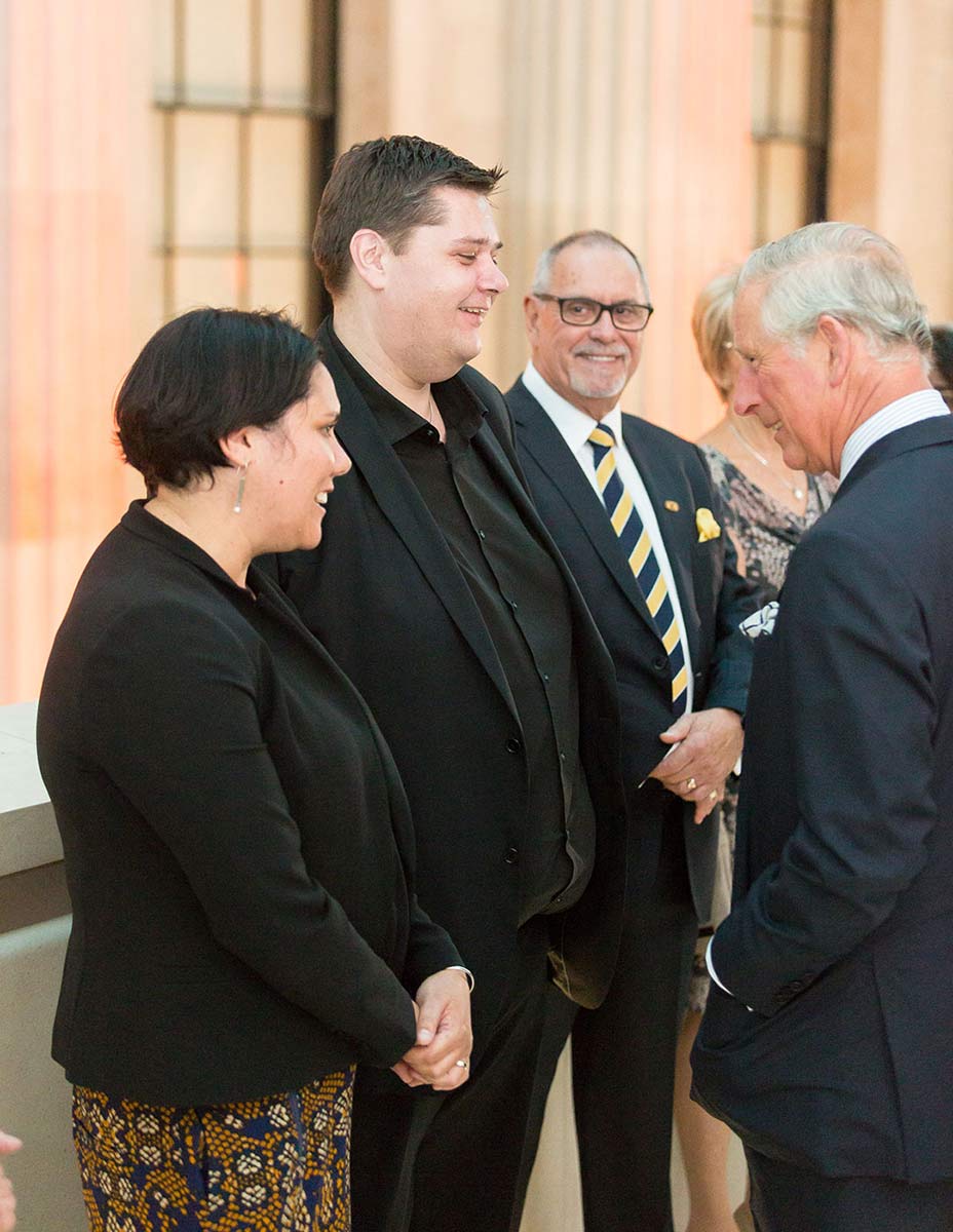 A photo of one woman and two men greeting HRH Prince Charles. - click to view larger image
