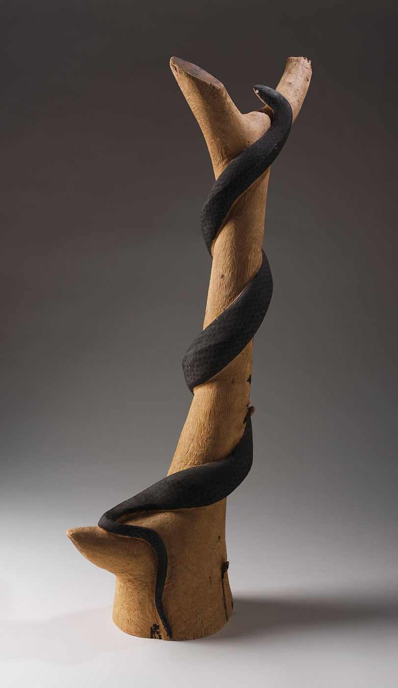 Carved snake 1973 made by Clifford Possum Tjapaltjarri. - click to view larger image