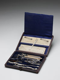 A case containing drawing instruments, opened to show the contents.