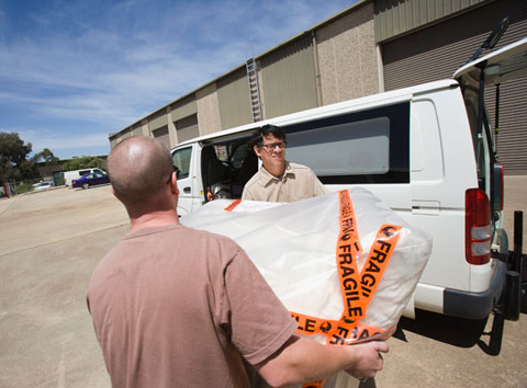 The chair is wrapped in calico and then sealed in polyethylene sheeting for freezing