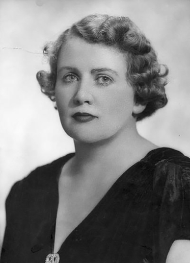 Black and white photo of Dorothy Tangney looking straight at camera.
