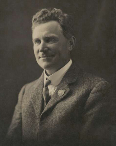 A black and white portrait photo of a man