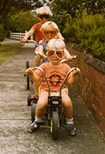 Three children in goggles Brighton 150w Three children on bicycles and wearing goggles