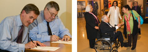 Two colour photographs side by side. The photograph on the left shows Neil MacGregor and Craddock Morton sitting at a table signing documents. The photograph on the right shows a group of five people. In the foreground a woman shakes the hand of a man sitting a wheelchair. Three women are in the background.