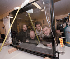 Conservators Robin Tait, Peter Bucke, David Hallam and Eric Archer with the new exhibition case for the John Batman Land Deed.