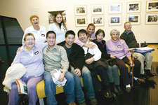 Community members help launch the photographic exhibition, Our Community.