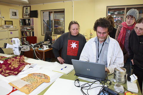 'What have we got?' Museum staff and students from the University of Canberra Conservation course look on intently waiting for the results of the initial investigation.