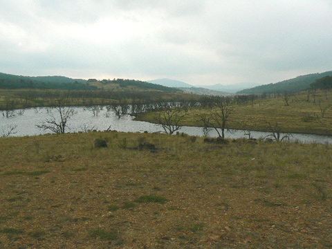 Watercourse with hills on the horizon