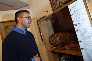 Ngambri man Paul House checks out the display of artefacts in the 1980’s ‘office’.