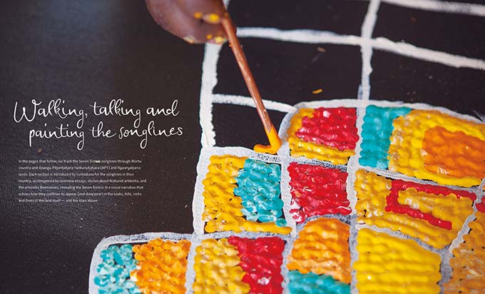 Songlines catalogue spread with text 'Walking, talking and painting the sonlinges' and a large detail image of a paintbrush on a canvas