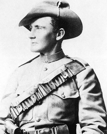 Black and white photo showing Morant from the waist up. He is in uniform with bandolier and slouch hat, face turned to his right
