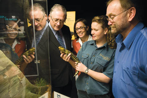 Renee Osterloh shows a blue-tongue lizard to Alan Draeger, Katy McDonald and Michael Pickering.