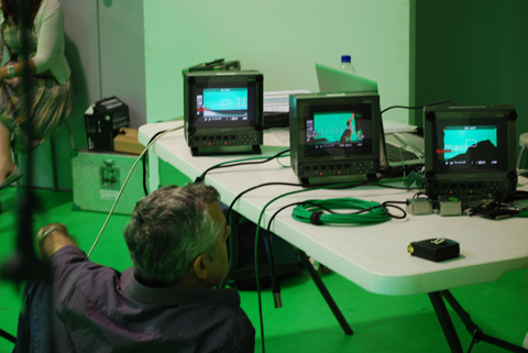 Director Michael Hill reviews the alignment of the camera output.