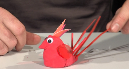 A colour picture shows a sculpture of a bird made from play dough