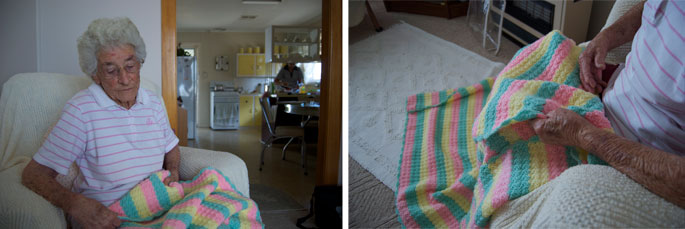 An elderly lady with a crochet blanket.