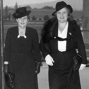 Two well-dressed women entering Parliament House in Canberra.