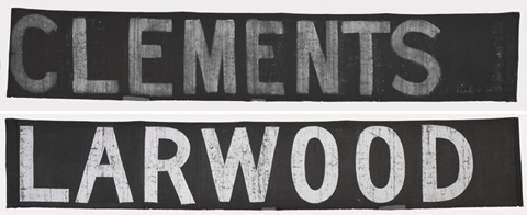 Black-brown cotton scoreboard banner painted in white letters. The banner is inscribed 'CLEMENTS', and on the reverse side 'LARWOOD'.