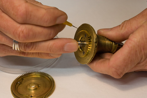 Fine synthetic watch oil is applied to the fusee ratchet wheel teeth.