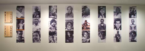 Portrait wall featuring photographs representing the many faces of the First Australians