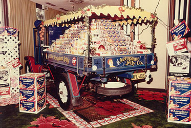 Rear view of a truck's tray, loaded with packets of jelly crystals.