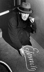 Arthur Stace 150w Black and white photo of a man drawing on the pavement with chalk
