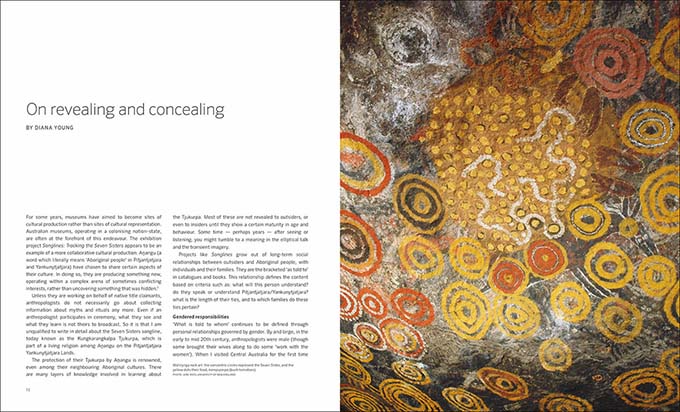 Songlines catalogue spread with text 'On revealing and concealing by Diana Young' and Seven Sisters rock art painting