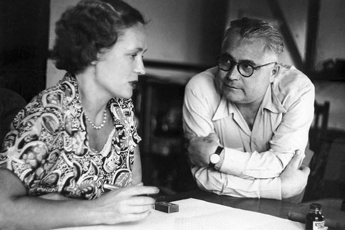 Man and woman talking at a table