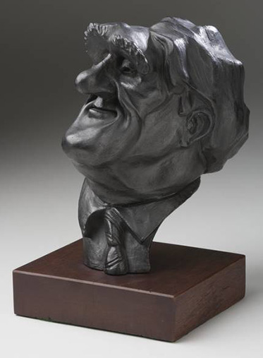 Sculpture titled 'The Dismissal - 20th Anniversary' by John Shakespeare. Three-dimensional comical figures of Opposition Leader Malcolm Fraser, Governor General Sir John Kerr, and Prime Minister Gough Whitlam are mounted on a piece of black painted board. The figure of Kerr is about to club Whitlam with a bottle of Champagne, while Fraser holds Kerr's coat tails.